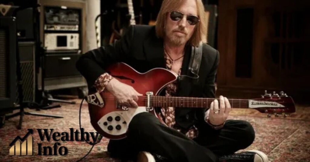 Tom MacDonald Net Worth – a rapper with a guitar in the studio.