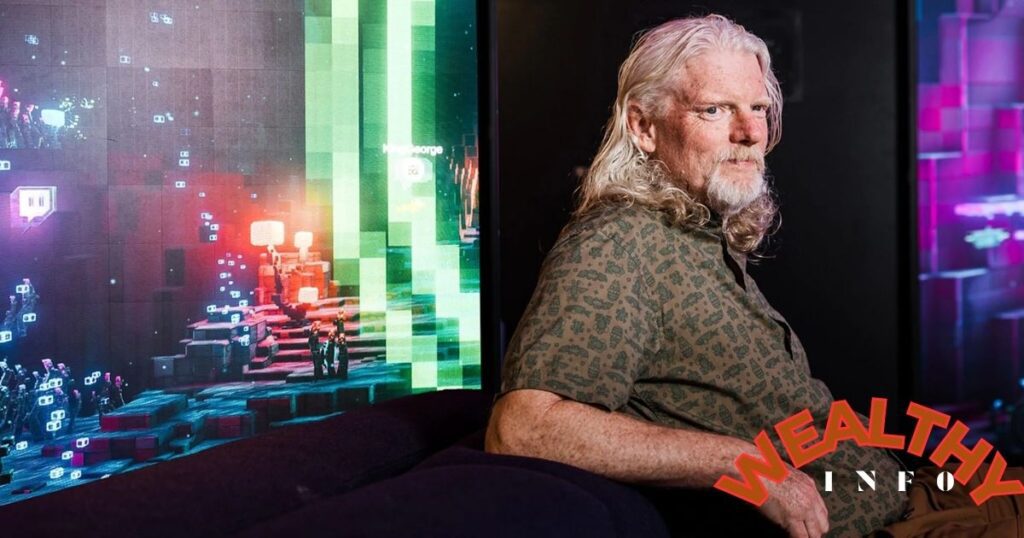 Dan Clancy Net Worth 2025 — Twitch CEO Dan Clancy sitting confidently in a tech studio, reflecting success and innovation.