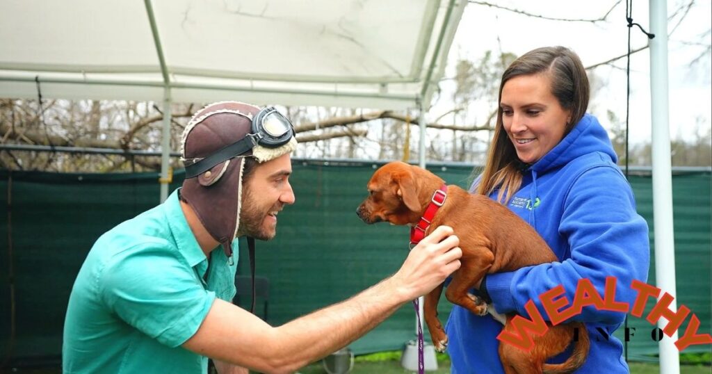 Mindy Mango interacting with a rescued dog, showing her compassionate lifestyle and financial generosity linked to her net worth.
