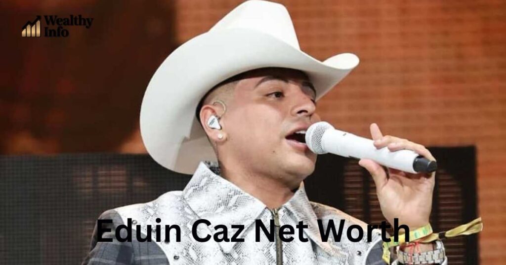 Image used for an article about Eduin Caz net worth featuring a performer singing on stage in a white cowboy hat.
