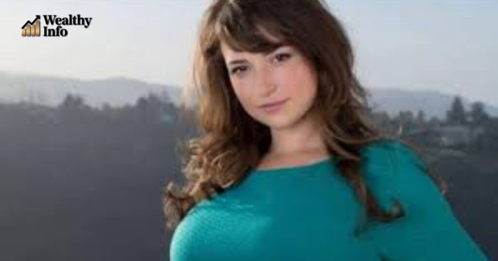 Milana Vayntrub posing outdoors with hills in the background — Milana Vayntrub movies and TV shows related image.
