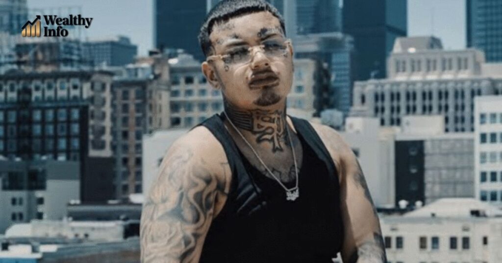 Swifty Blue posing on a rooftop in Los Angeles city skyline – Swifty Blue net worth