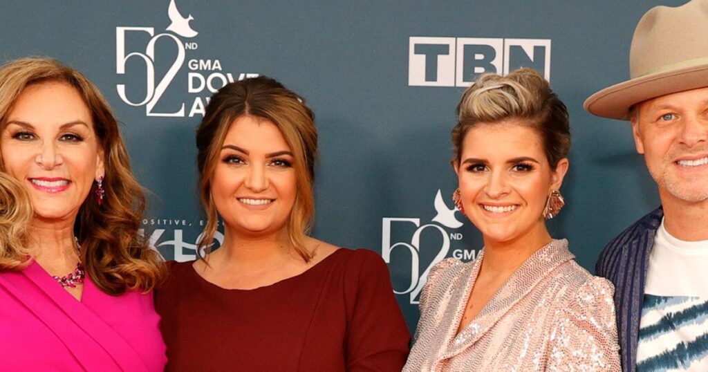The Nelons family smiling on the red carpet at the 52nd GMA Dove Awards, showcasing their enduring success and contribution to The Nelons Net Worth.