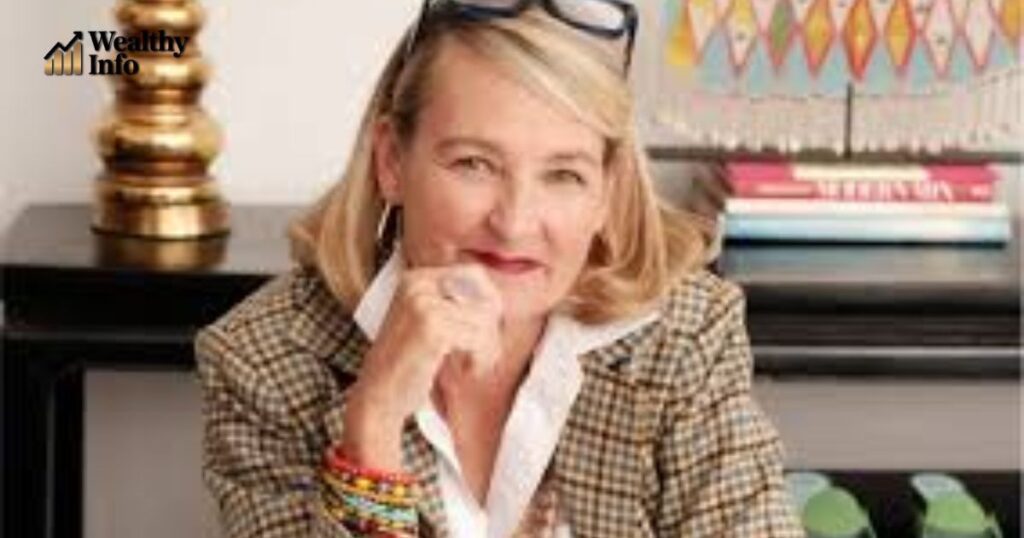 Professional woman seated at a desk, representing discussions about Elyce Arons net worth.