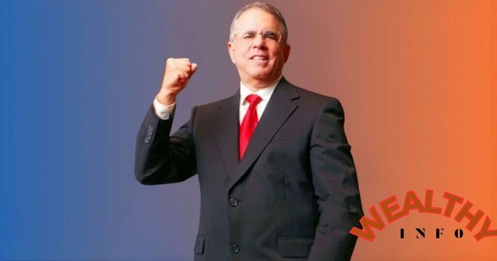 Jim Adler net worth — The Texas Hammer standing confidently in a suit and red tie.